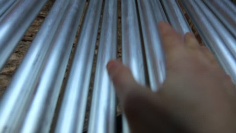 incredible sound of hundreds of aluminum tubular bells played by a hand