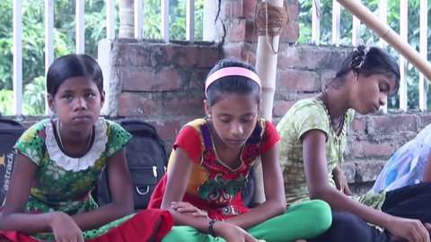 Girlstudents eating vegetarian food at a village school  in India