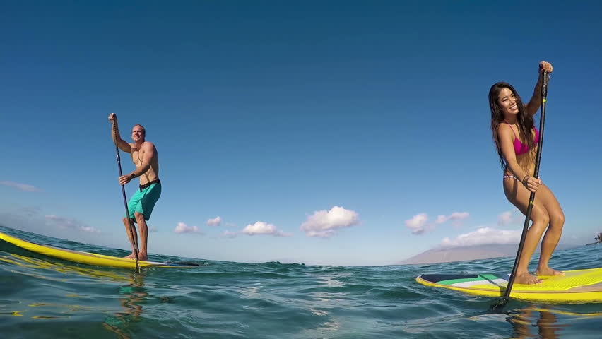 Active Couple Stand Up Paddling In Hawaii, Summe Sport 