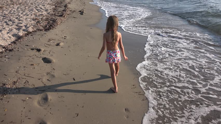 4K Child Playing on Beach Coastline in Waves Little Girl Running Walking Sea Kid