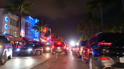 MIAMI BEACH - DECEMBER 30: Stock video of people getting ready to celebrate the 2016 New Year on Ocean Drive December 30, 2015 in Miami Beach FL, USA