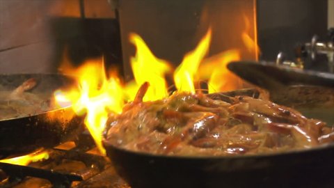 Slow motion of Gambas cooking. Find similar in our portfolio.