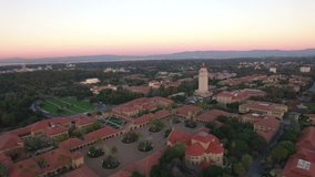 4K Aerial drone shot Stanford University toward tower sunset