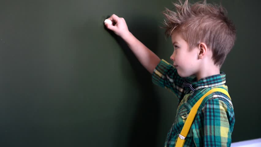 student solves equation at the chalkboard
