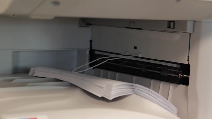 Copy Machine spits out paper