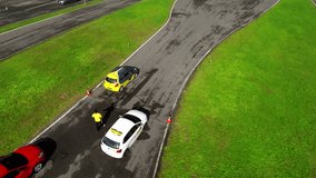 In this video, we can see a yellow car driving on a slippery track at the automobile event. Wide-angle shot.