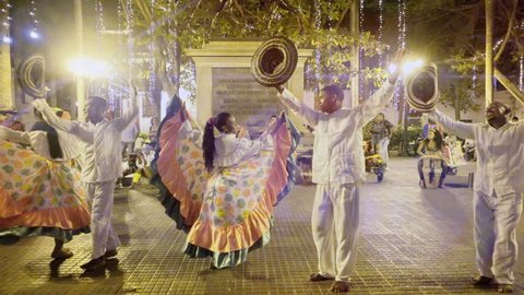 CARTAGENA, COLOMBIA - CIRCA DECEMBER 2015: Afroamerican dancers performing Colombian folkloric dance on  a public square. Slow motion