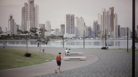 Runners on coastline at sunset, Panama City. 4k