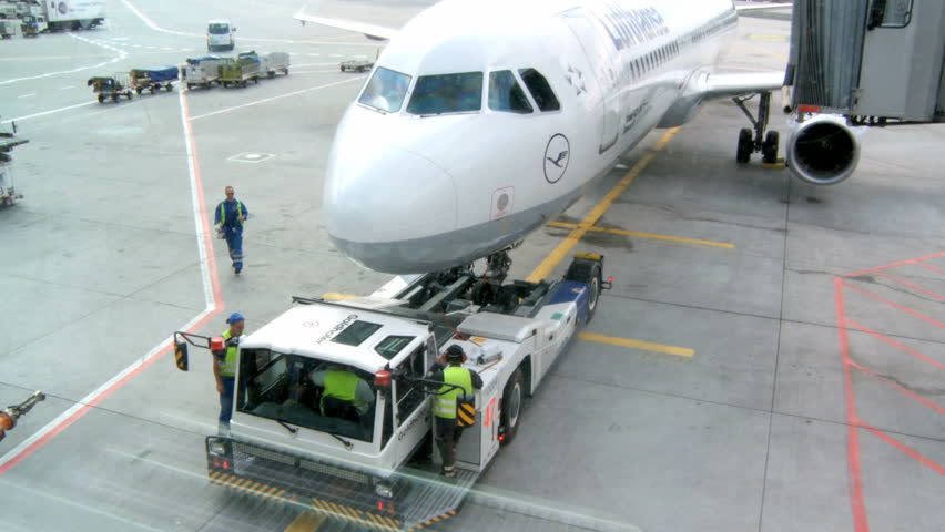 FRANKFURT, GERMANY - MAY 23 Airplane gets attached to Moving Vehicle on May 23,