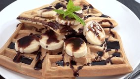 Rotating Waffles with Banana slices and Chocolate sauce (not loopable, 4K)