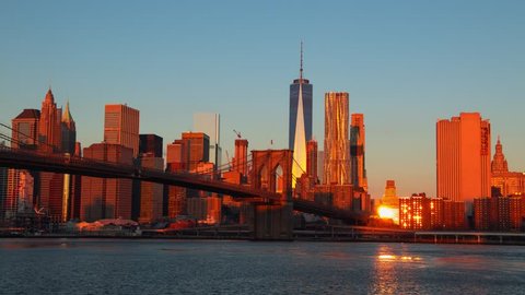 USA. New York. The skyscrapers of Manhattan and the Brooklyn bridge. Dawn. Time lapse 4K