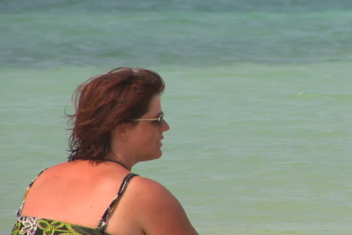NTSC: Girl in shallow water of ocean - close up
