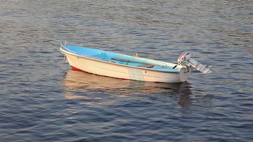 Small motor boat on the silent sea 