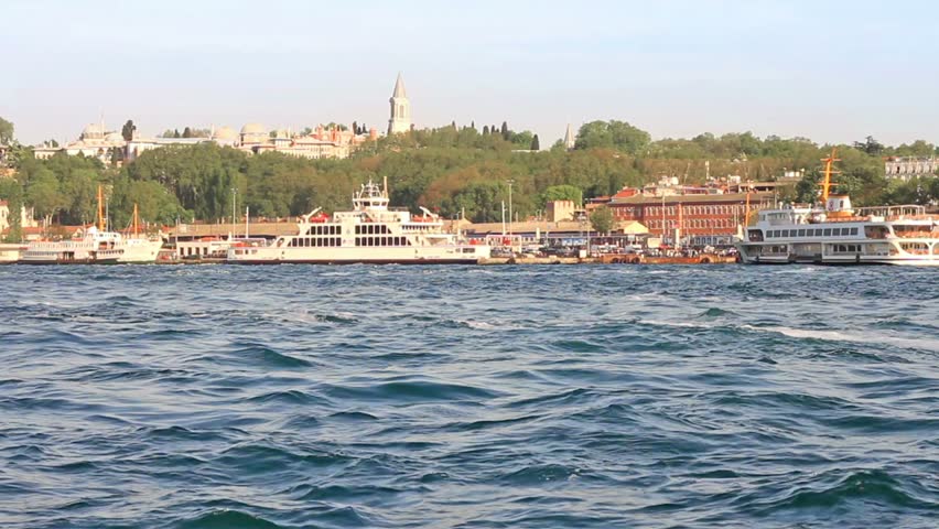 Luxury yacht speeds up in front of Istanbul port 