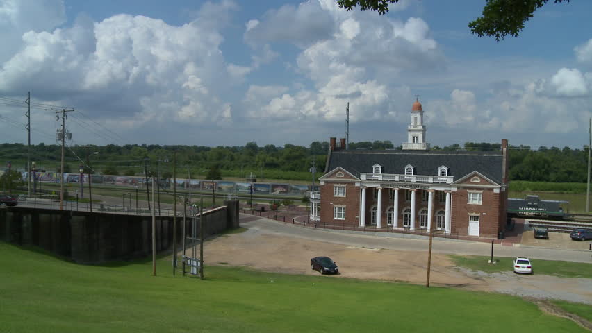 Old train depot in Vicksburg, Mississippi near railroad tracks and the river. 