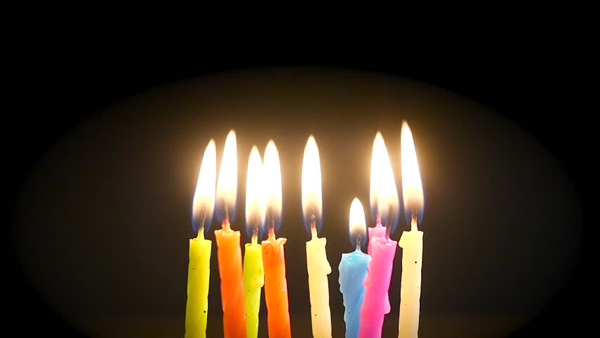 Colourful small birthday candles being lit and blown out, close up Royalty-Free Stock Footage #13698233