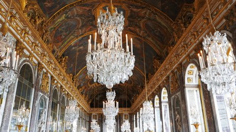 VERSAILLES, PARIS, FRANCE- SEPTEMBER 23, 2015: a wide gimbal shot of the ceiling of the opulent hall of mirrors in the palace of versailles