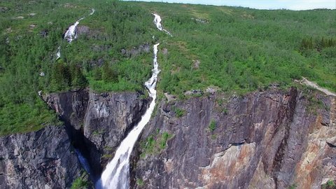 Amazing aerial view of famous Voringfossen waterfall in Norway on sunny summer day. Aerial 4k Ultra HD.