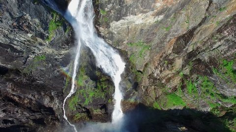 Aerial view of famous Voringfossen waterfall in Norway on sunny summer day, major tourist attraction on the way down from Hardangervidda to Hardangerfjord. Aerial 4k Ultra HD.