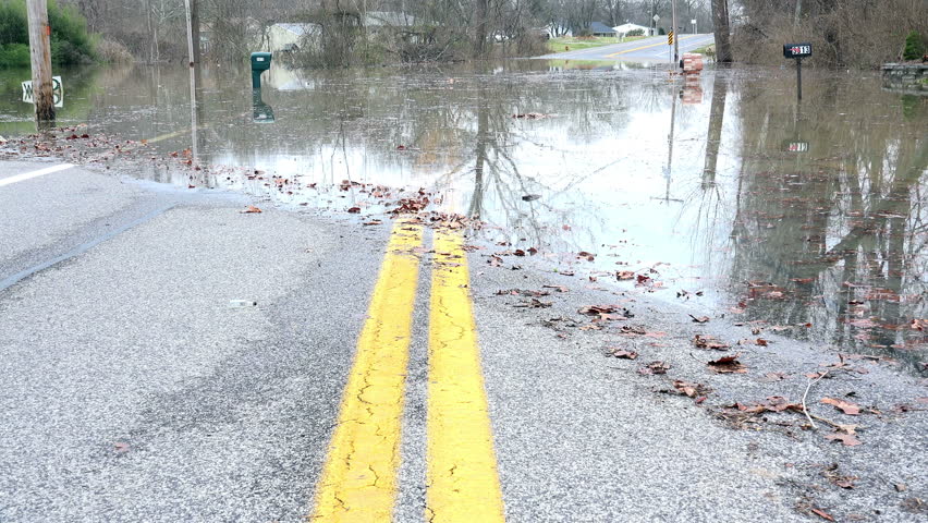 A roadway in south St. Louis is covered by flood waters from the Meramec River following heavy rains that hit the area