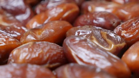 Palm dates fruit packed n the original package 4K 2160p 30fps UltraHD  tilting footage - Phoenix dactylifera  dried Arabic fruit in row close-up 4K 3840X2160 UHD video