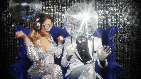 introducing mr and mrs discoball. two cool club characters dance and pose in a nightclub setting
