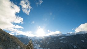 Day to night timelapse, the sun setting down behind mountains and transition into a starry night over the Val d'Anniviers, a valley in the canton of Valais, pennine alps, Switzerland.