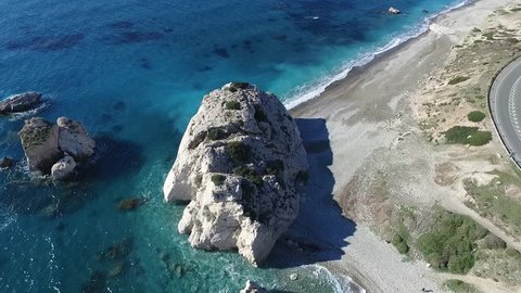 Huge rock in the sea near the shore, magnificent aerial view, blue crystal clear water, Cyprus sea shore, nature beauty