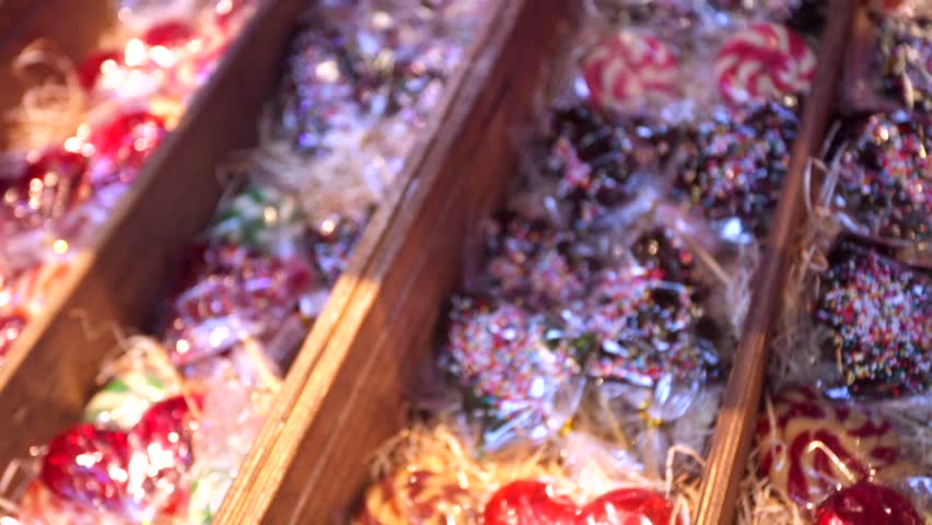 multicolored lollipops on a store shelves. Candy on stick with twisted design. 