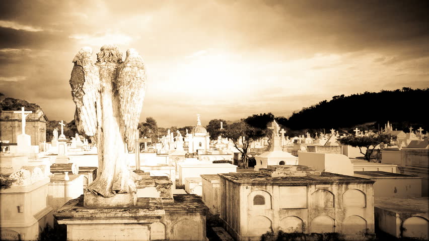 angel in a grave yard time lapse sunset