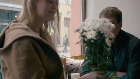 Loving couple looking at each other in cafe