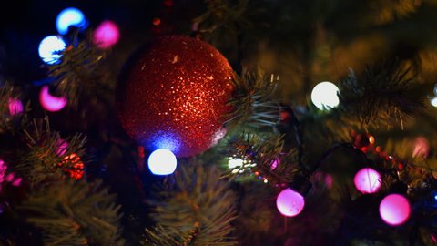 Christmas and New Year Decoration. Abstract Blurred Bokeh Holiday Background. Christmas Tree Lights Twinkling. Glowing Background. 4K 30fps