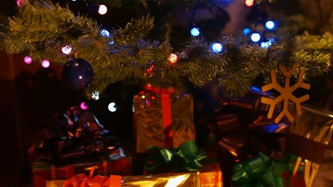 Christmas and New Year Decoration. Christmas gifts under the Christmas tree. 4K 30fps ProRes (HQ)