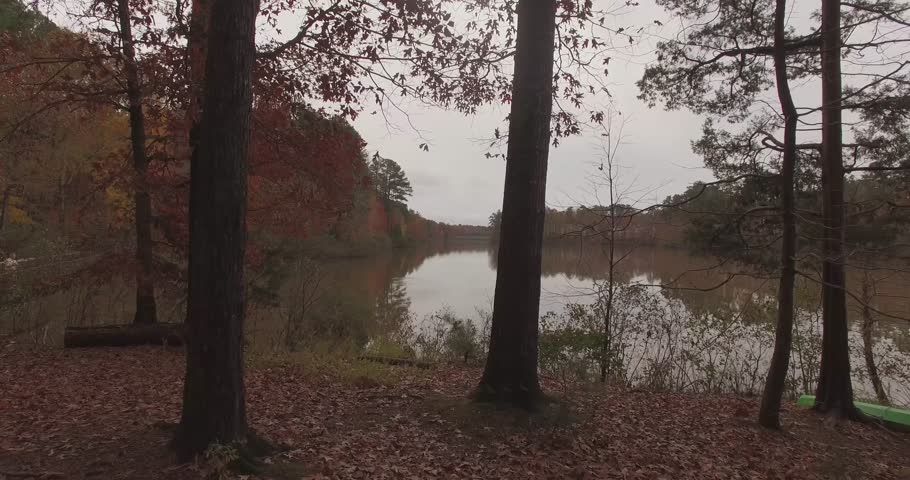 Lake Lynn in NW Raleigh, NC in autumn.  A brief shot moving from land over water.