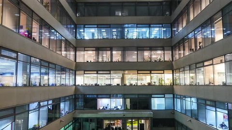 zoom out Time lapse of busy city office workers together in large modern office building
