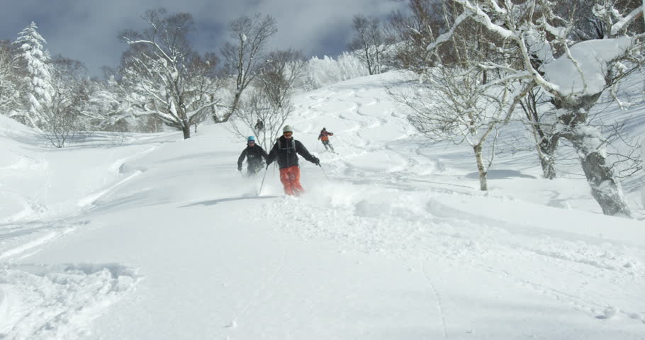 Hokkaido, Japan - Group of skiers descending on a volcano. Ski powder snow hiking climbing free ride. Hokkaido, Japan February 2016. | Shutterstock HD Video #13785782