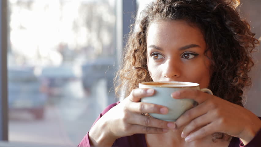 Girl with a wonderful smile drinking coffee | Shutterstock HD Video #13792547