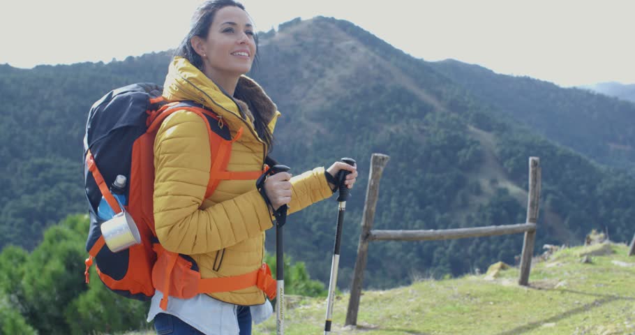 Attractive young woman out backpacking