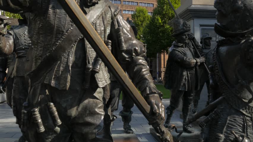 Tilt from Night Watch to Rembrandt Statue on Rembrandtplein Amsterdam. Shot on a sunny morning in 4K