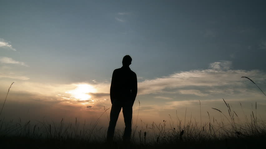 Silhouette of man on the sunset. Freedom concept. Royalty-Free Stock Footage #1379626