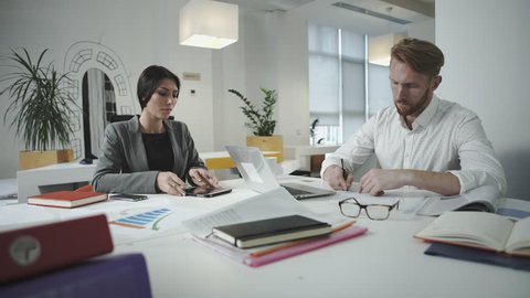 Two employees working in the office