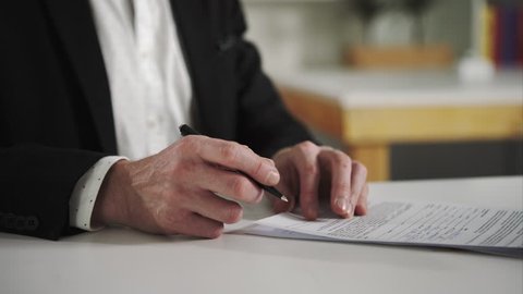 Businessman signs documents