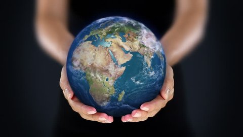 Female hand holding a realistic Earth. Starting in North America. The Earth globe starts showing Europe and is loopable from frame 98 to frame 547.