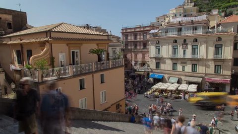 The main square of Amalfi with the crowd of tourists exploring the town in summer