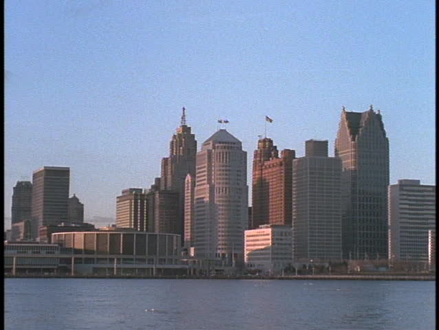 Detroit skyscrapers tower over the river waterfront.