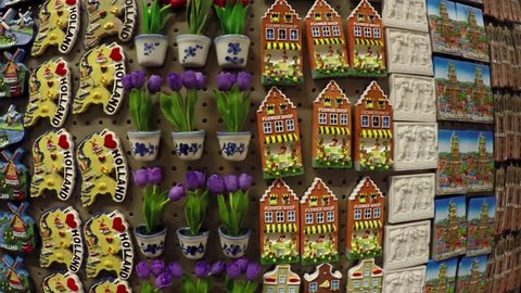 Dutch refrigerator magnets in a tourist shop in Holland the Netherlands very colorful display with small Dom Towers tulips canal houses wooden shoes magnets made for tourism popular as presents 4k