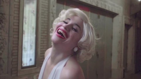 vintage style close-up of Marilyn Monroe girl laughing and twirling her white dress showing panties in slow motion, 1080 HD 
