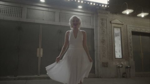 Marilyn Monroe beautiful under street lights outside theater in slow motion 1080 HD