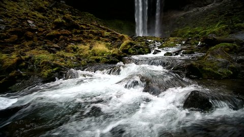View of Tamanawas Falls with flowing river in Oregon.