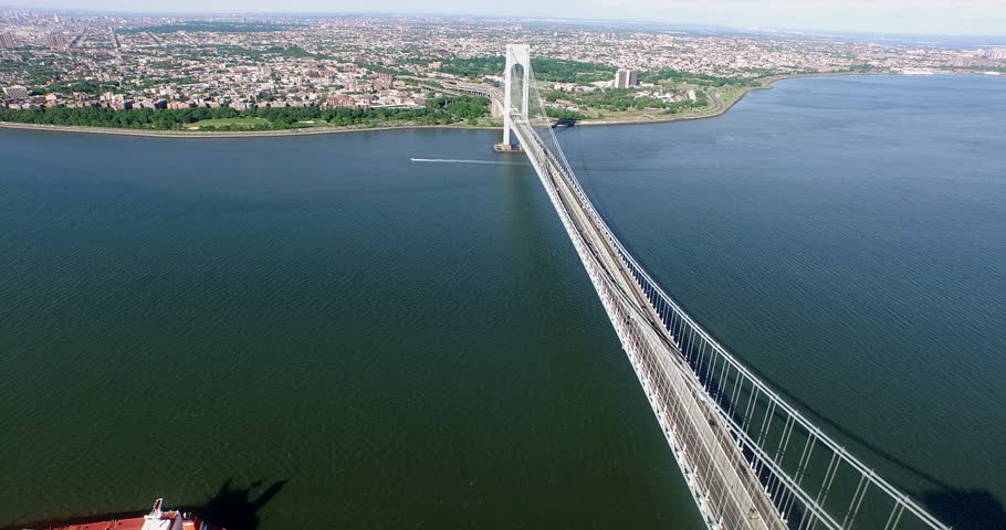 A loaded oil tanker passes beneath the Verrazzano-Narrows Bridge toward the Brooklyn shoreline in New York Harbor, 2015.